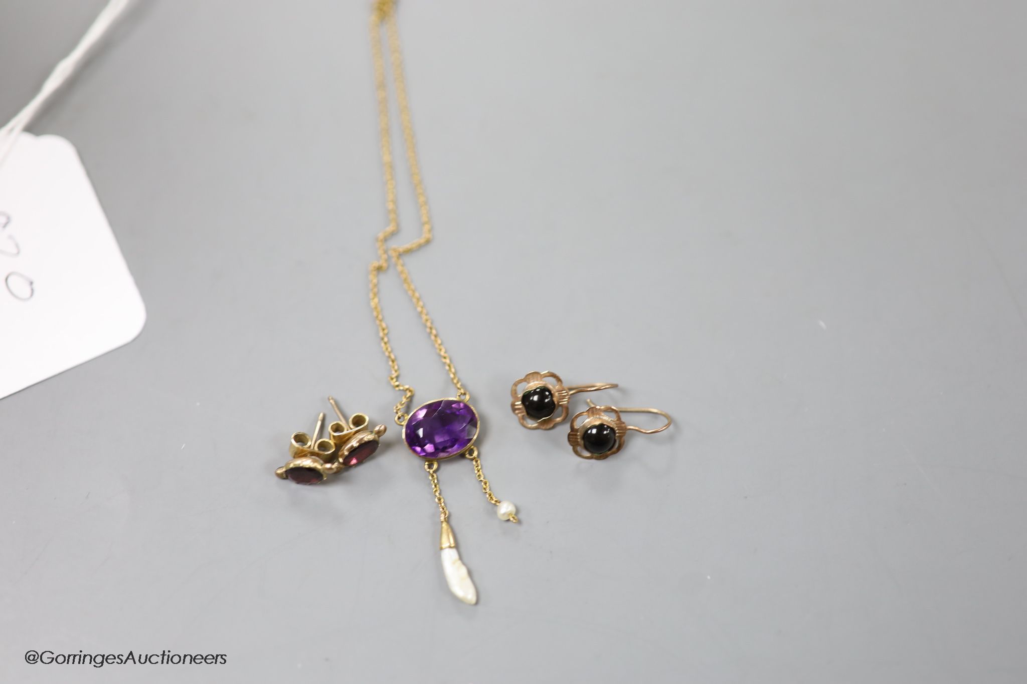 A 15ct amethyst and baroque pearl drop pendant (stone missing) and two pairs of yellow metal and gem set earrings